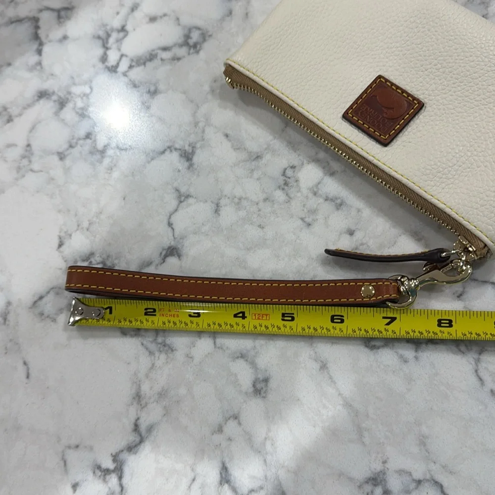 ￼New without tag Dooney and Bourke large wristlet wallet. Creamy white. - Picture 9 of 9